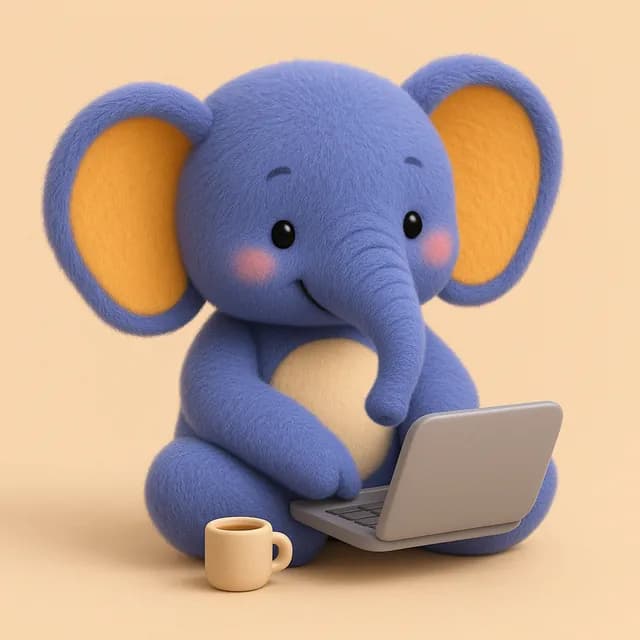 Tola, Narachi's baby elephant, typing on a laptop beside a cup of tea.